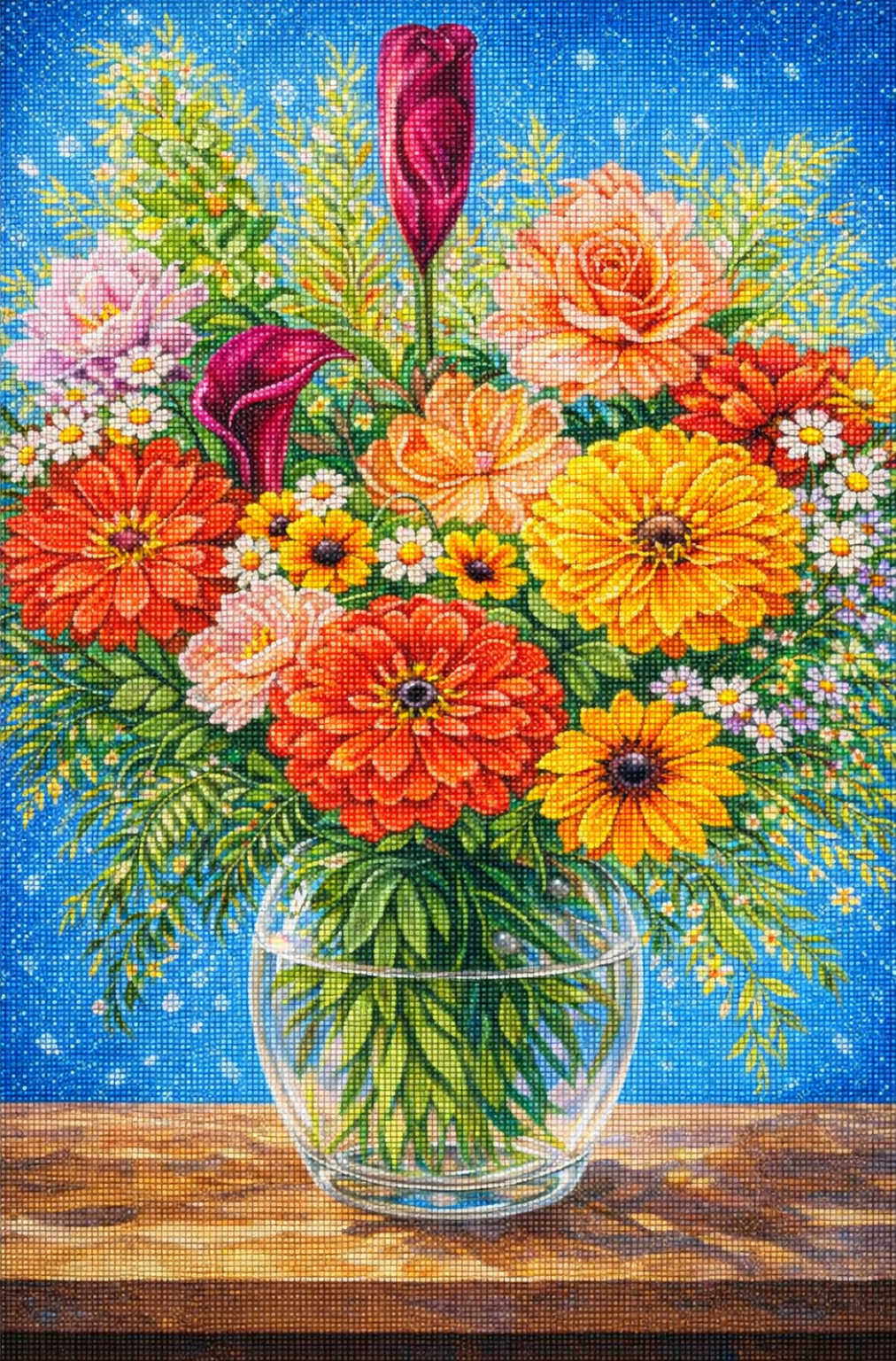 Colorful bouquet of flowers in a glass vase on a wooden surface with a blue background